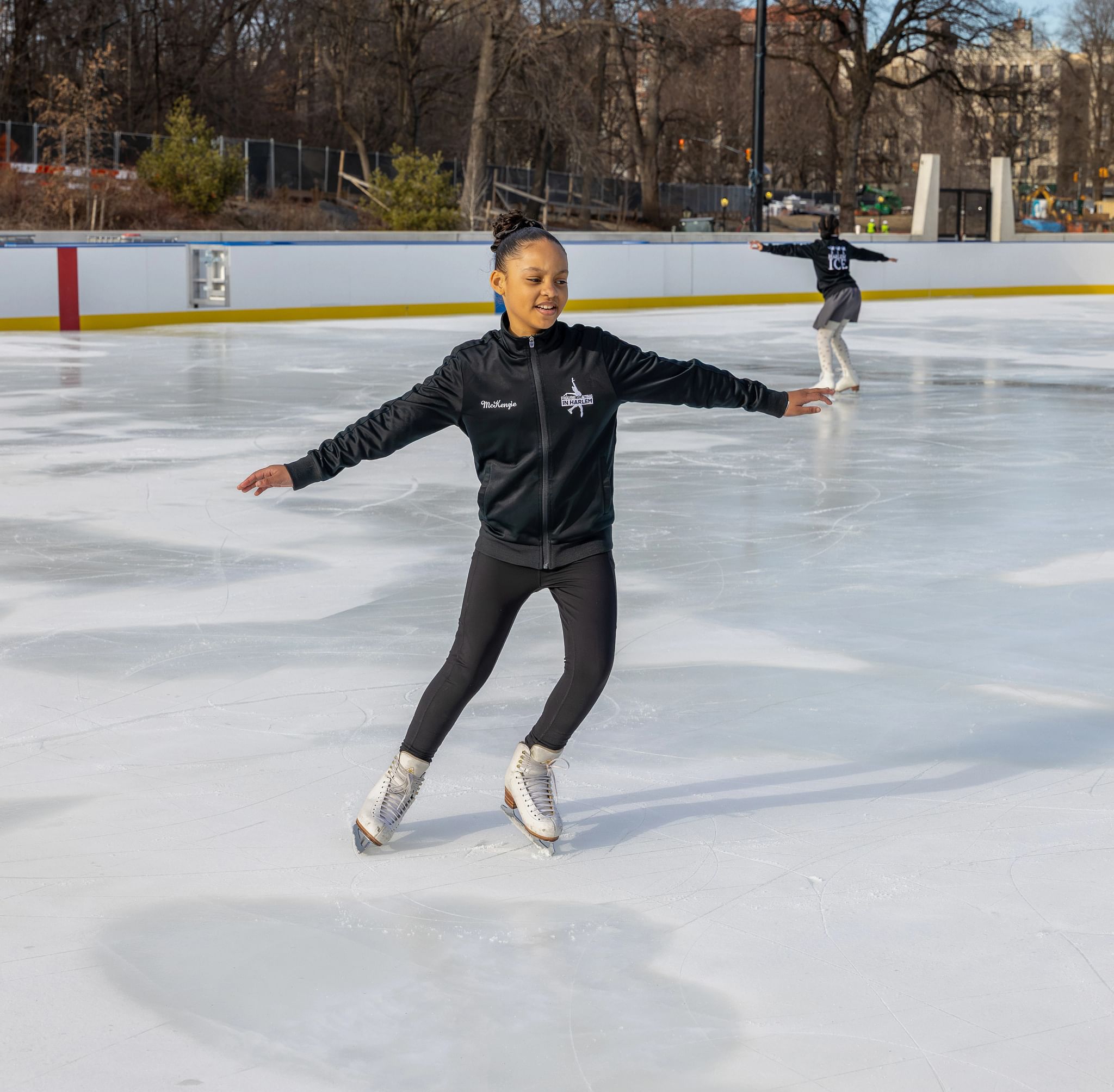A person figure skating in Harlem at the Davis Center, NYC