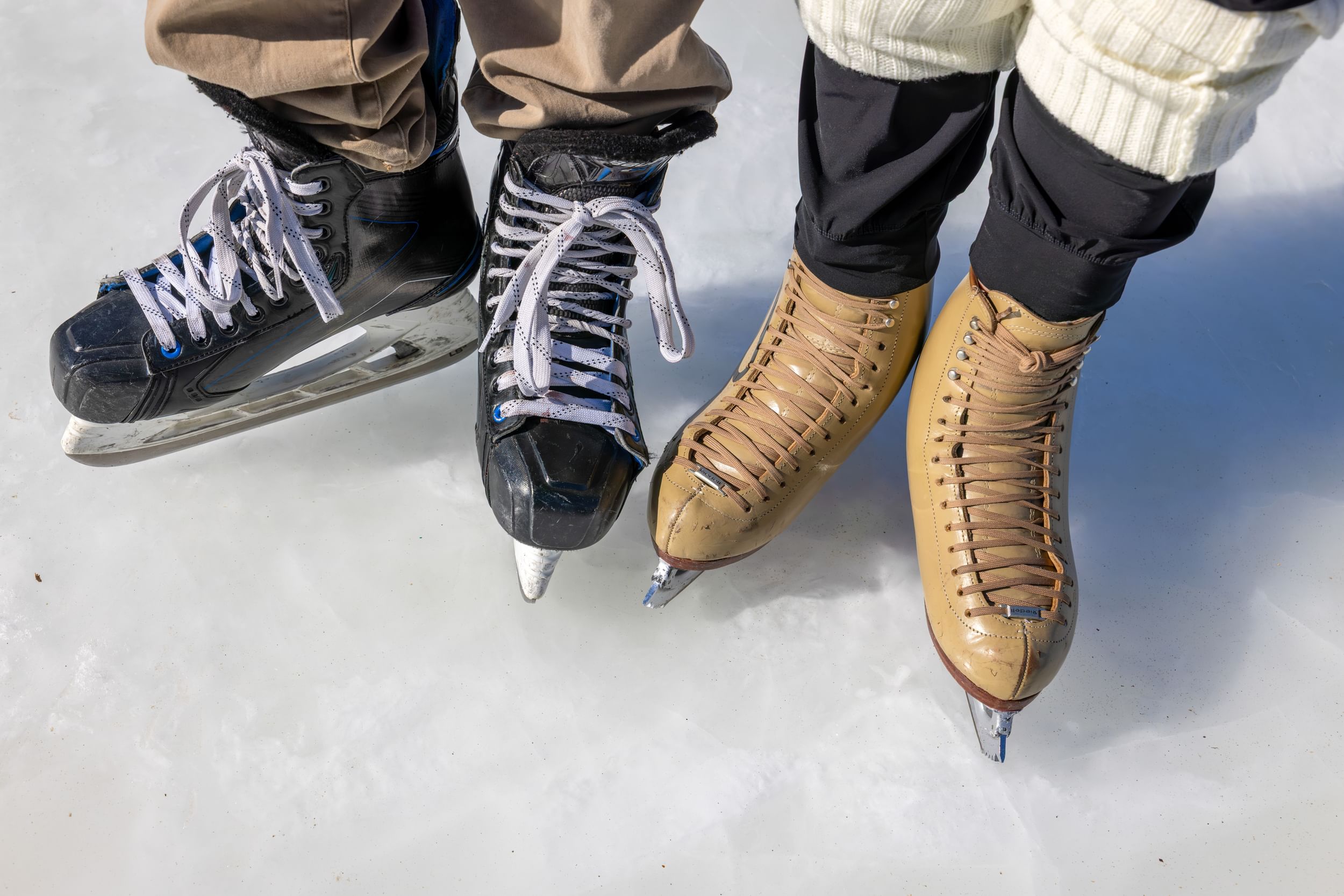 Closeup shot of two people wearing ice skates