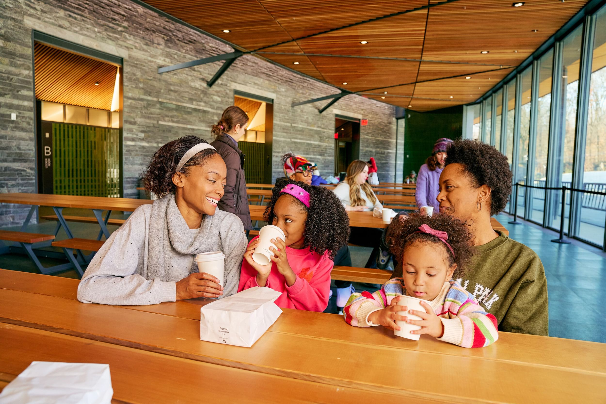 Visitors at the Davis Center enjoying food and drink at the indoor space