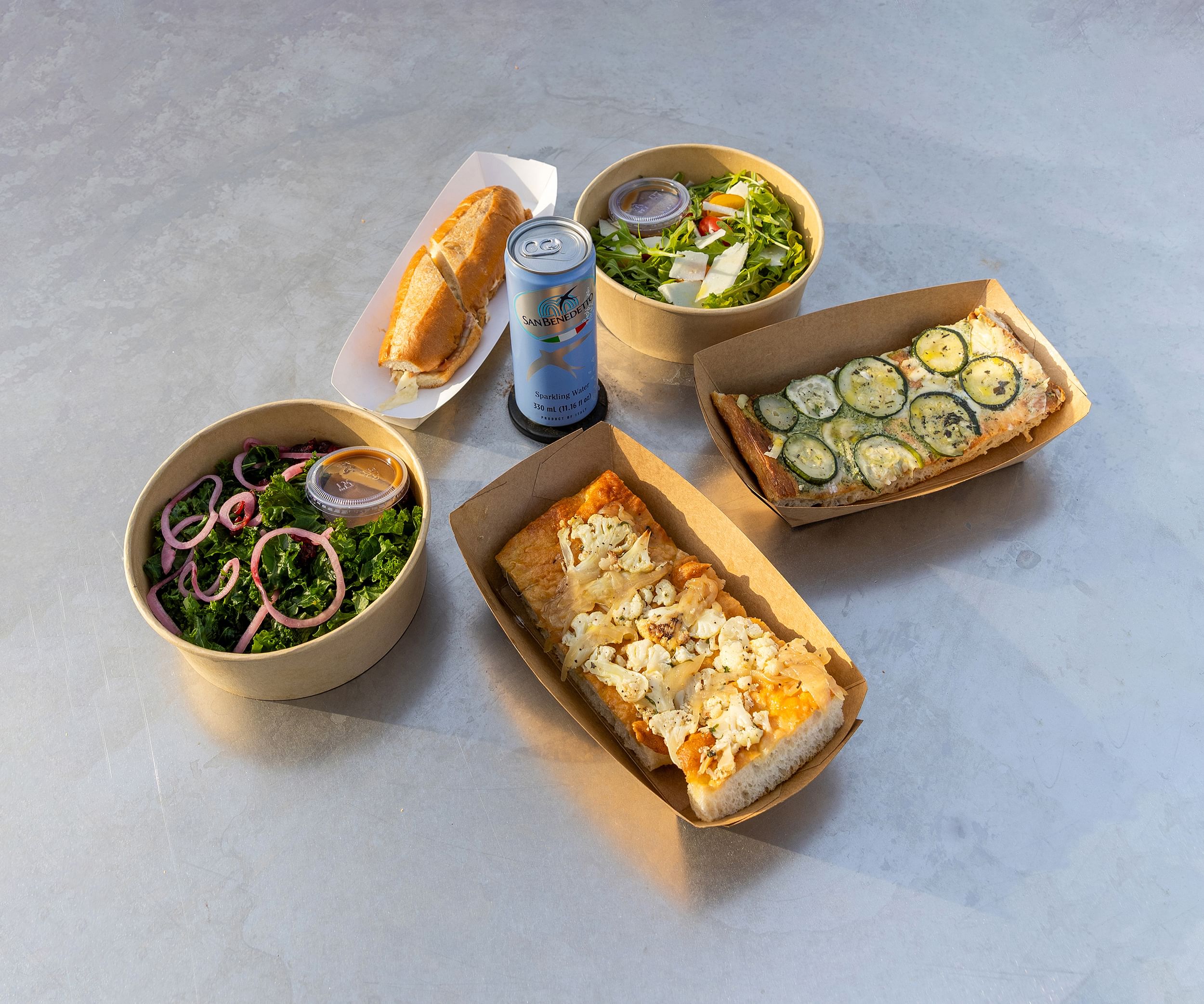 Photo of various food, salads, sandwiches and a drink