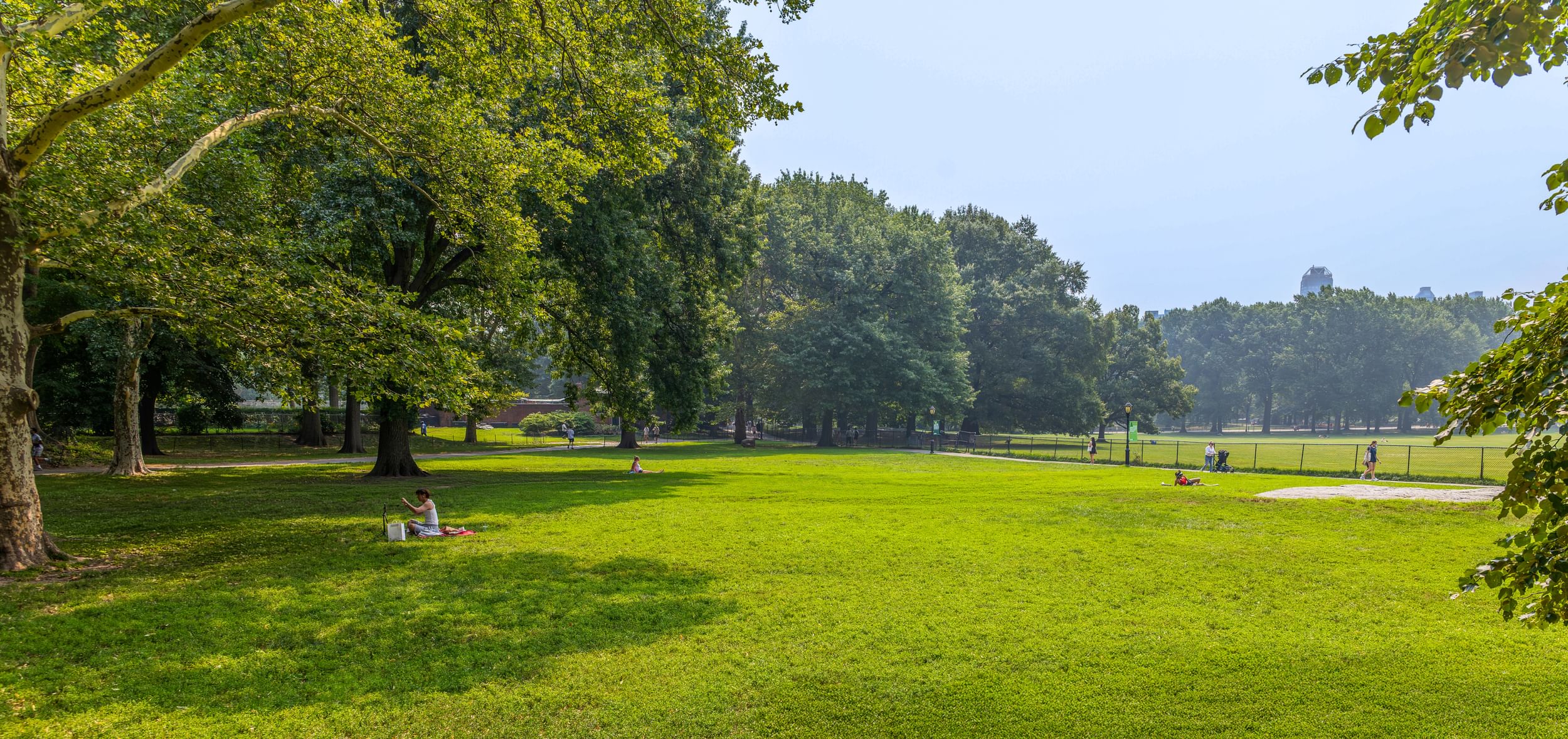 Park visitors picnicking on a lawn near Mineral Springs