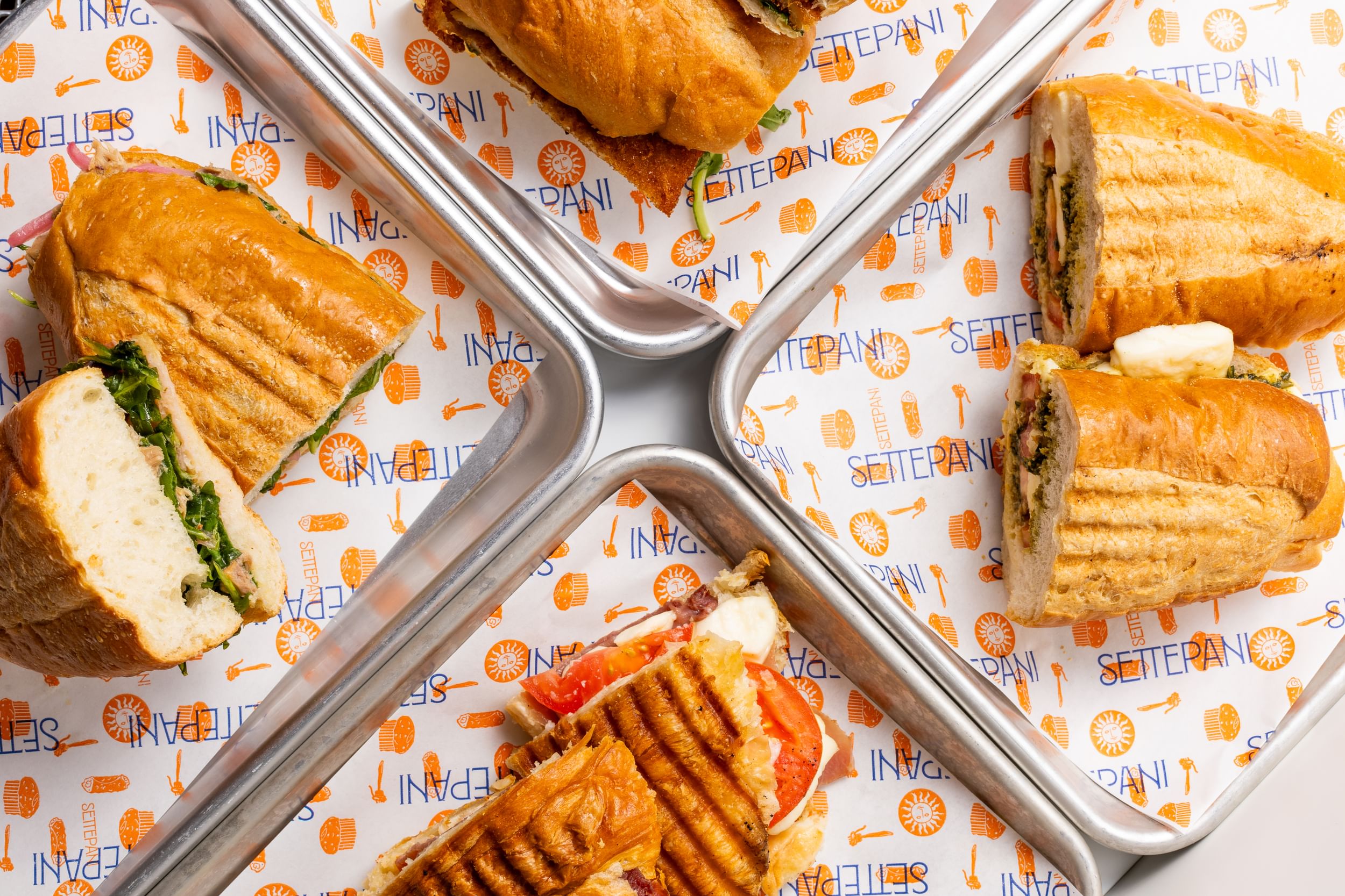 Caprese, tonno, beef burger, and pollo milanese paninis made by Settepani